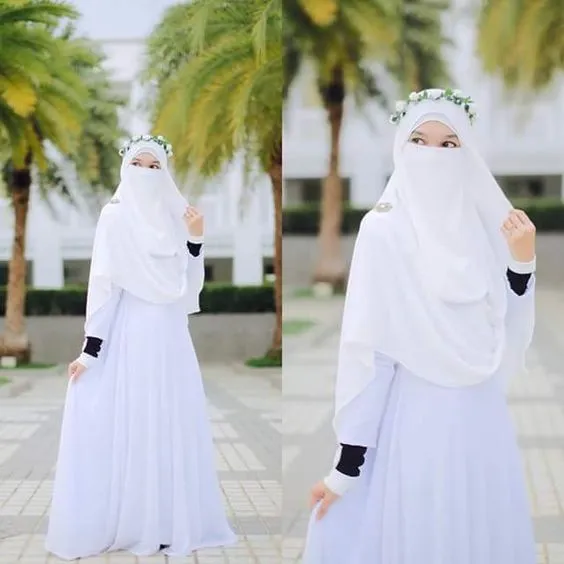 14 Inspirasi Gaun Pengantin Syar'i Berwarna Putih. Tampil Cantik dengan Jilbab Lebar, Kenapa Tidak? 26