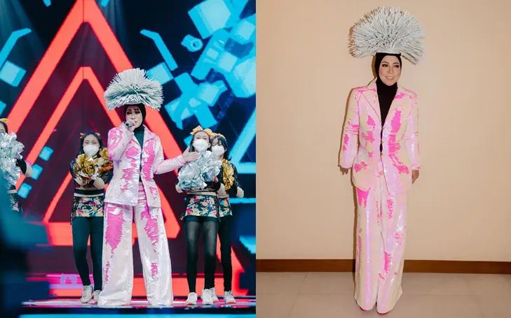 10 Gaya Nyentrik Melly Goeslaw di Panggung, Hiasan Kepalanya Variatif Banget! 17 Melly Goeslaw