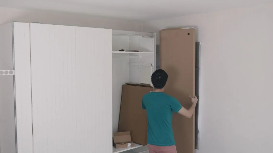 Designing Your First Room? Here Is How AI Floor Plan Makes It Way Less Stressful 8 Person arranging furniture in a small room.
